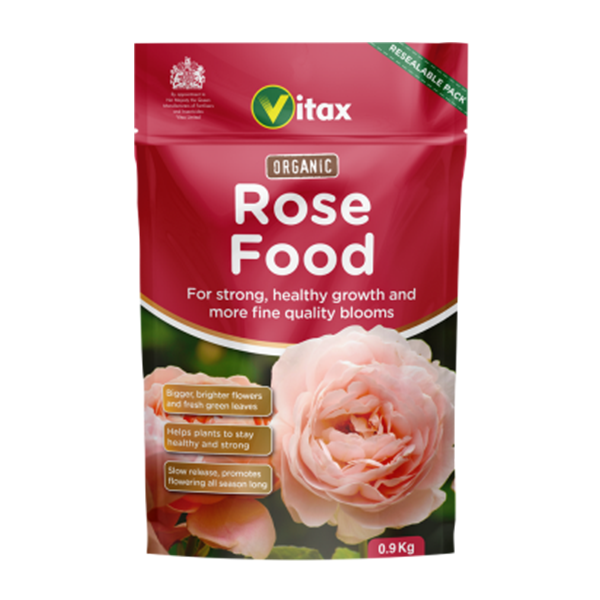Vitax's Organic Rose Food - 900g comes in a red package and is ideal for organic gardeners, promoting strong growth and quality blooms through effective soil enrichment. It includes an image featuring a pink rose.
