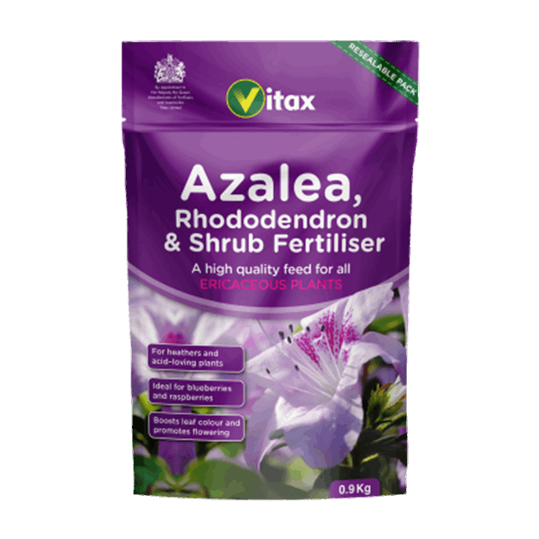 The packaging of Azalea, Rhododendron & Shrub Fertiliser - 900g is purple and features a white azalea flower design, making it ideal for plants that thrive in acidic conditions.